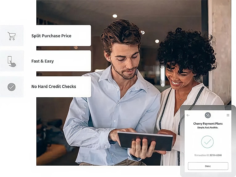 Couple discussing payment plans on a tablet.