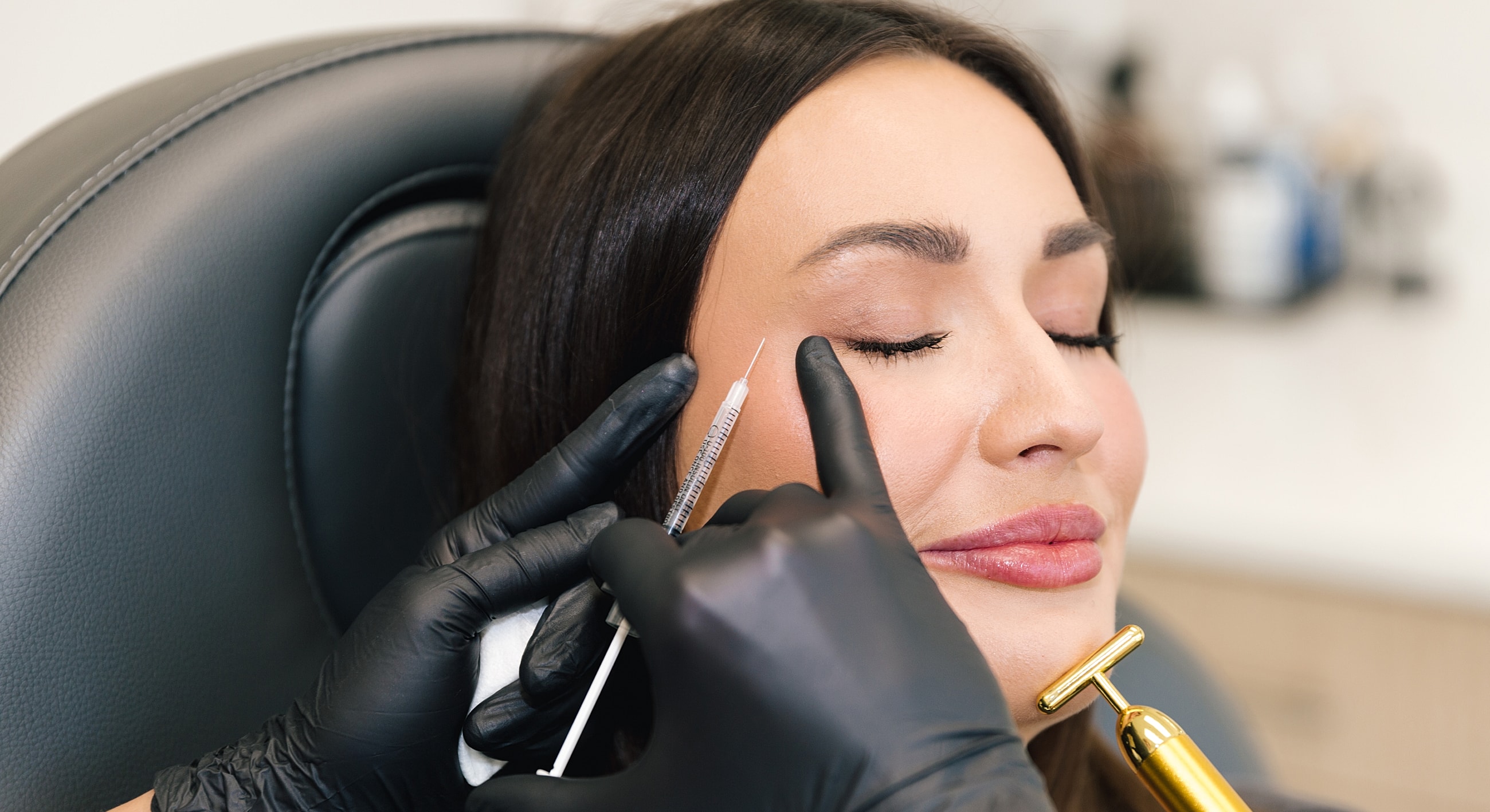 Cosmetic procedure in progress with patient relaxing.